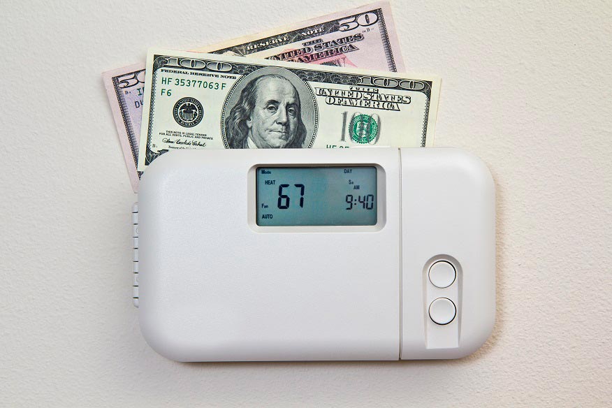 Dollar bills inside the thermostat