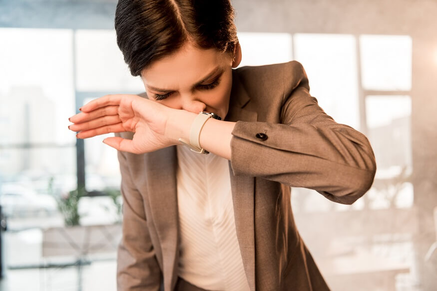 woman covering nose