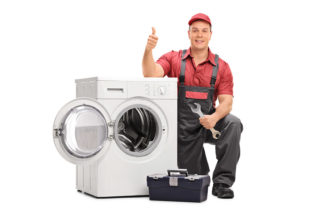 appliance repair man with a dryer