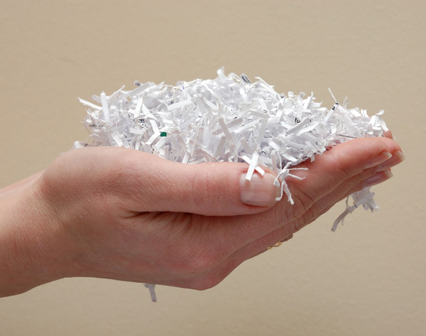 woman holding shredded paper