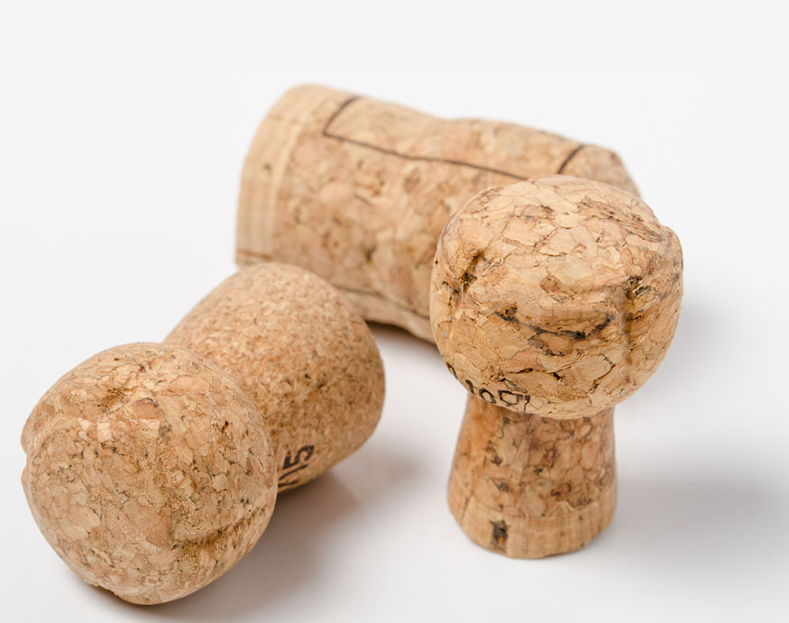 close up picture of three bottle corks
