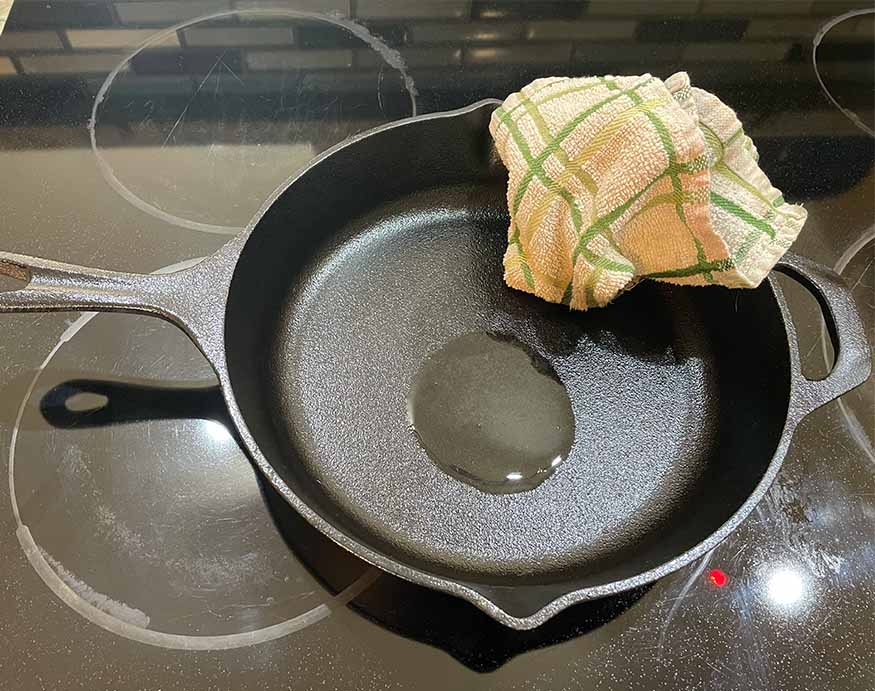 cast iron skillet with oil for seasoning