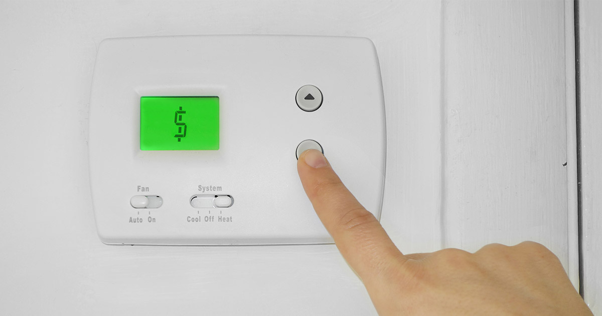turning down the thermostat to save money