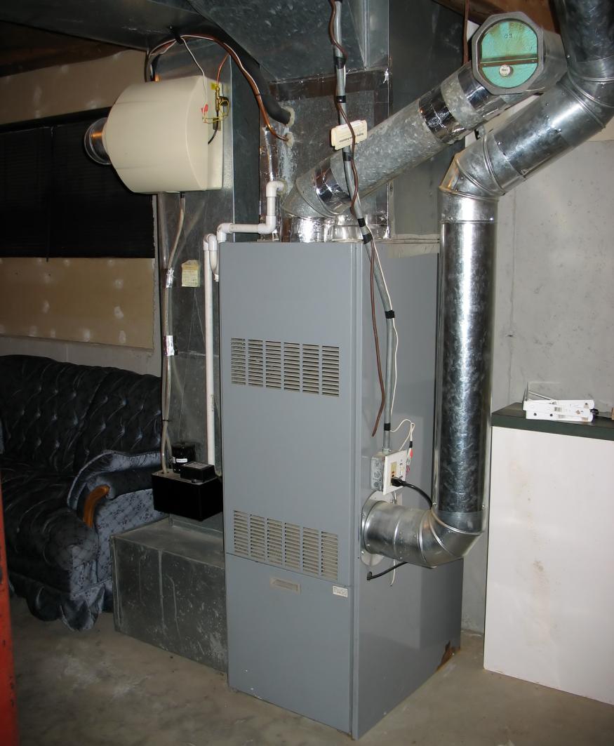 A gray furnace in a room.