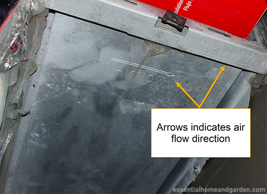 airflow direction arrows on furnace closeup