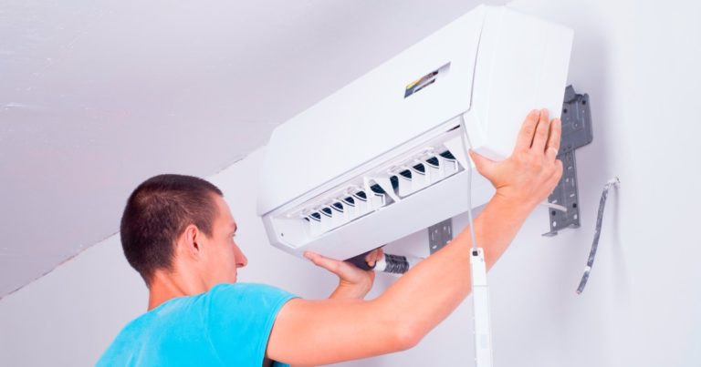 an HVAC professional installing a mini-split AC