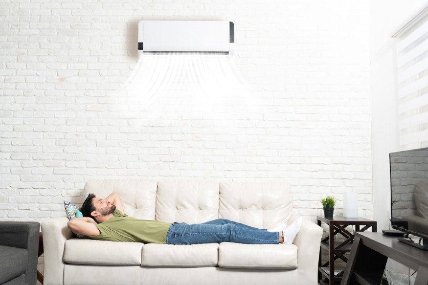 a person sleeping with the dual inverter AC switched on