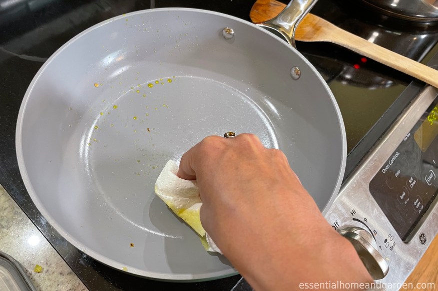 cleaning a Caraway Cookware using a soapy rag