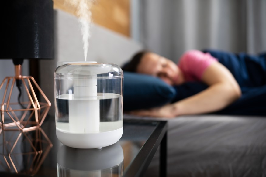 a steam vaporizer on the bedside table