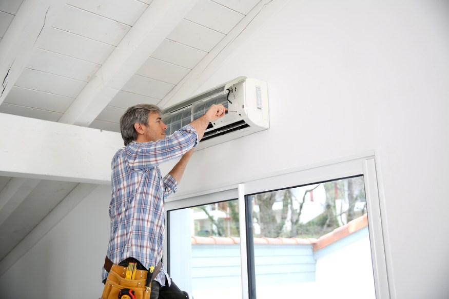 an electrician installing an AC