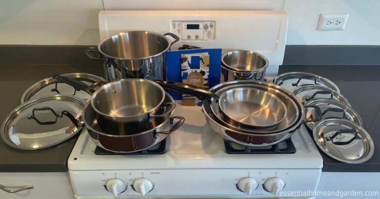 full set of Legend Stainless Steel Copper Core and manual on a stove