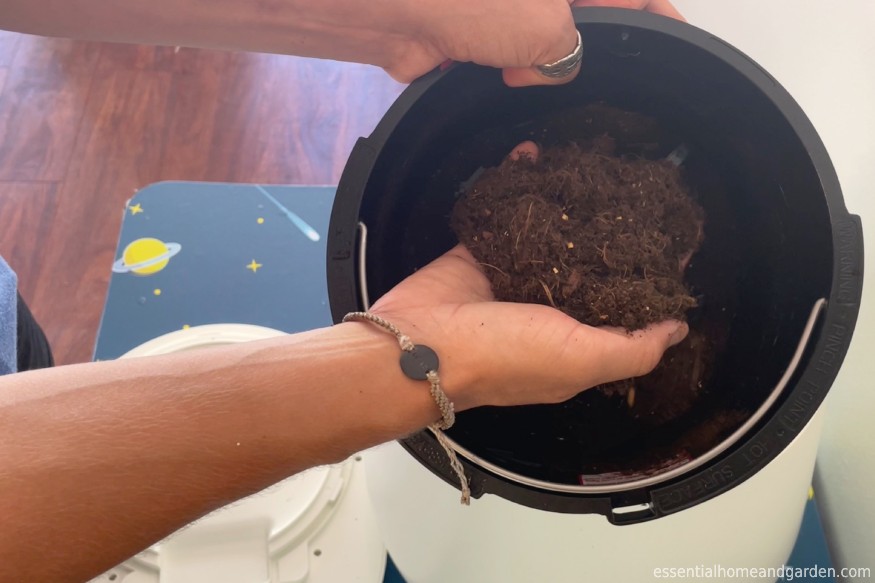 holding finished compost from Lomi Home Composter