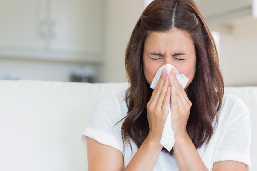 woman sneezing