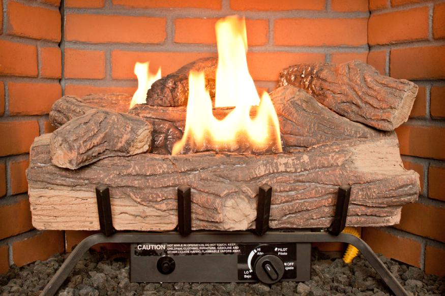a photo of a gas fireplace with real flames