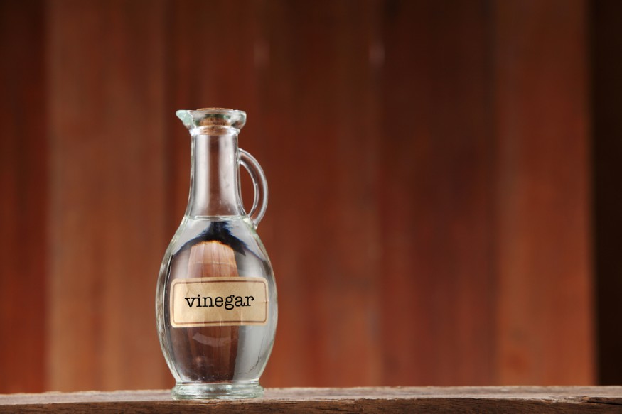 a bottle of white vinegar on a table