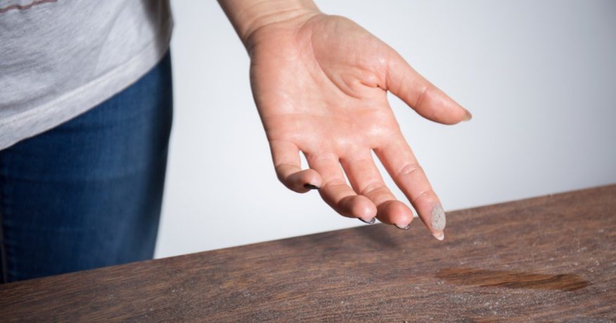 white dust on a woman’s finger