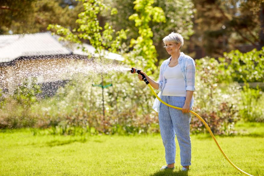 woman watering lawn