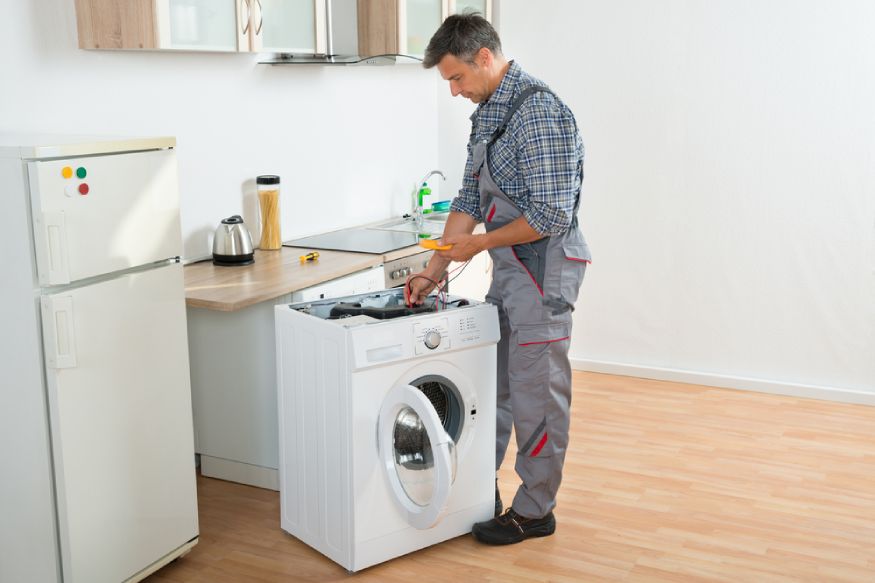 technician checking the washer