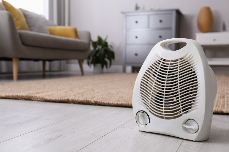 a fan heater sitting on the floor