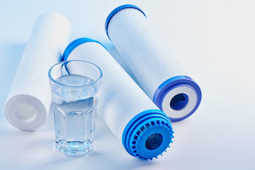 water filters and a glass of water on the table