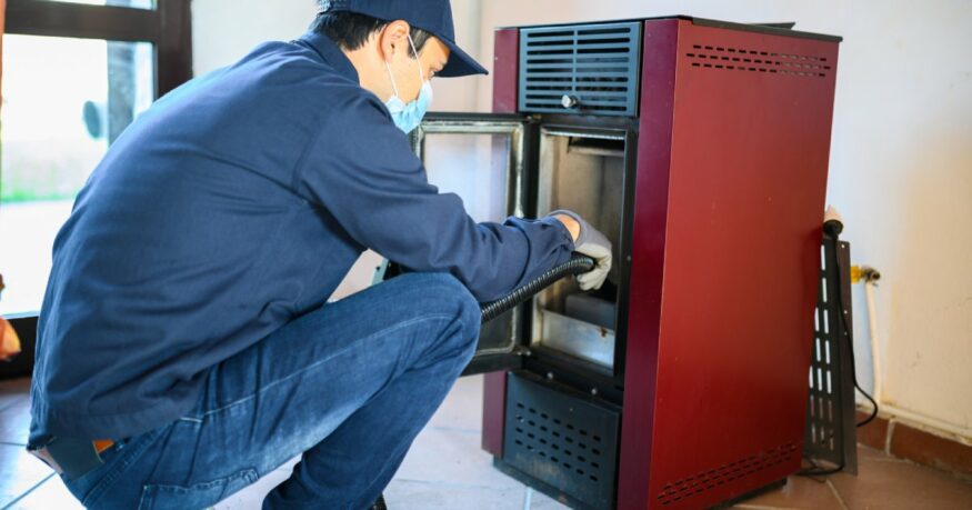 technician checking a pellet stove