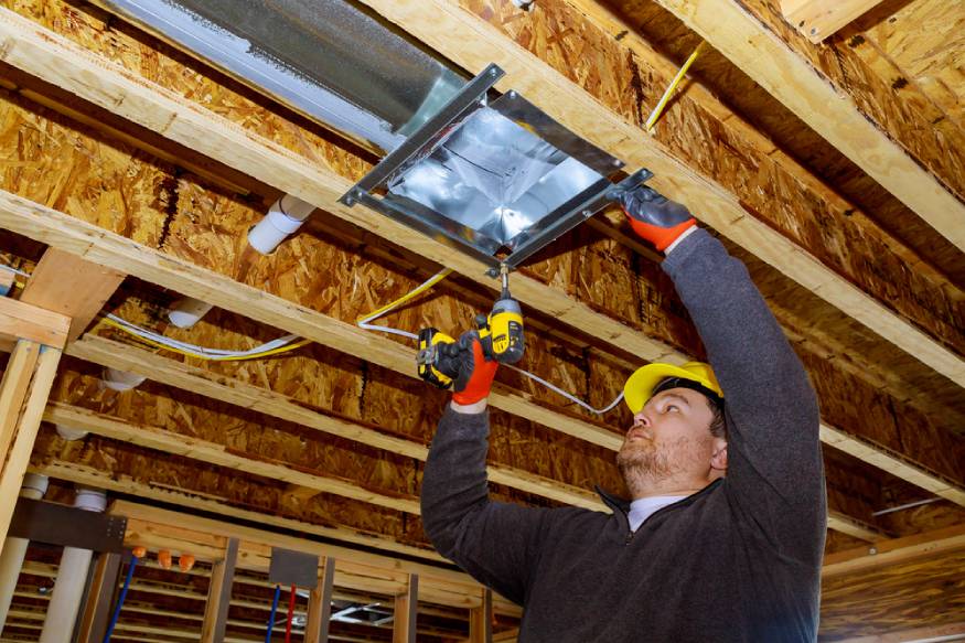 technician installing HVAC ductwork