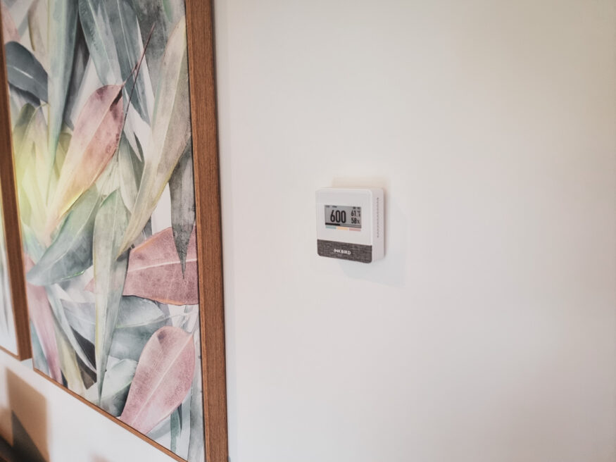 A wall mounted IAM-T1 Air Quality Monitor